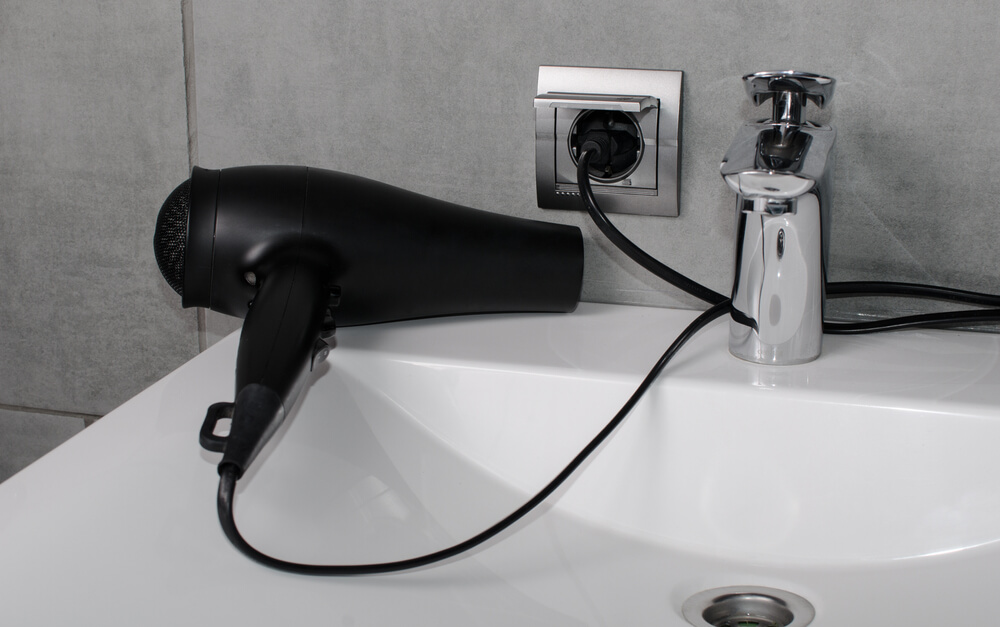 hairdryer next to sink