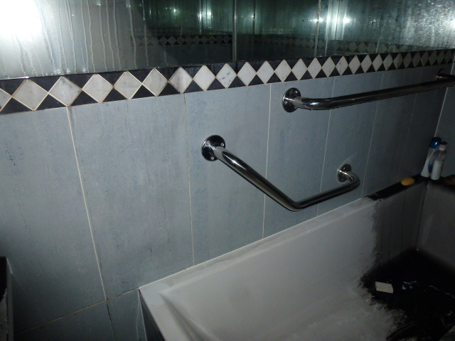 Test clean showing removal of smoke and soot contamination from bathroom tiles
