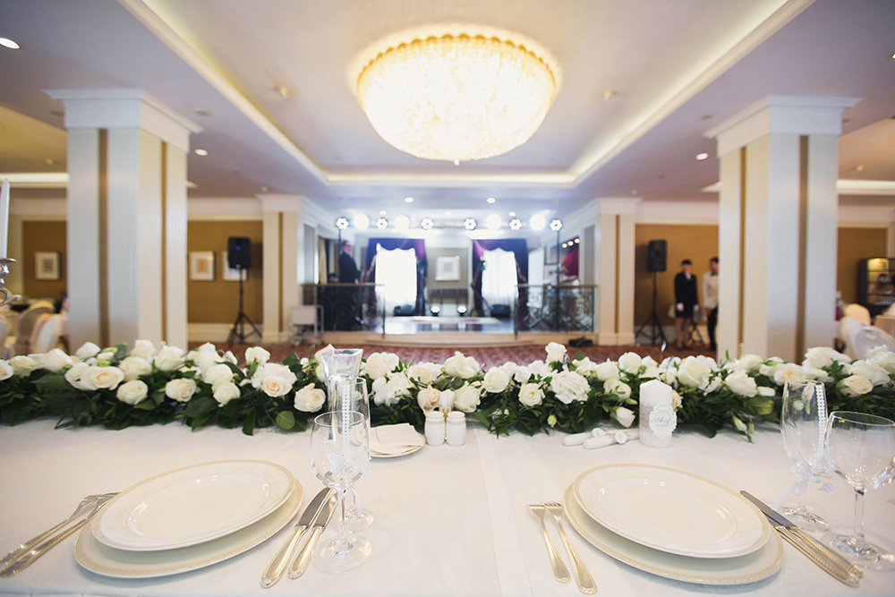 Illustrative hotel function room prepared for a wedding