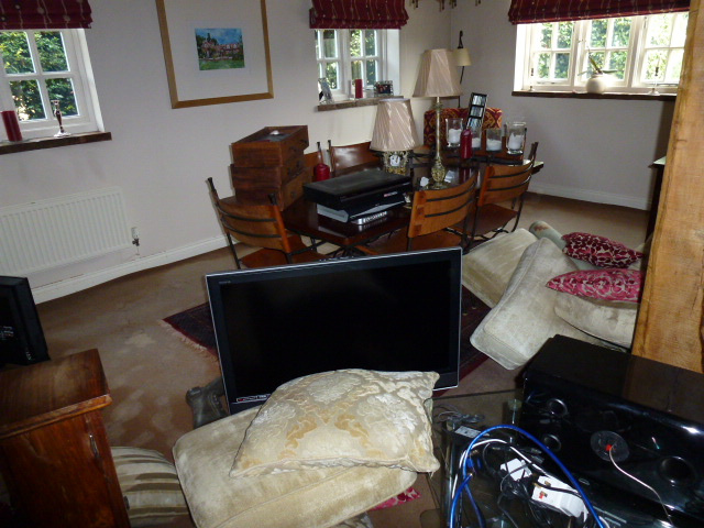 Living room furniture and contents affected by severe domestic flooding