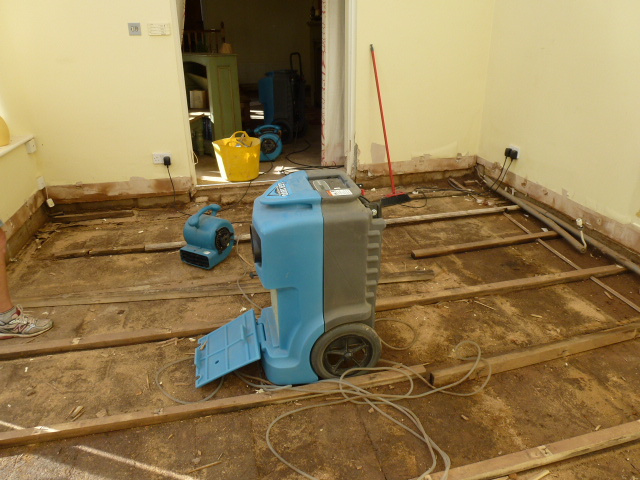 Restorations UK drying equipment operating during strip-out after severe domestic flooding