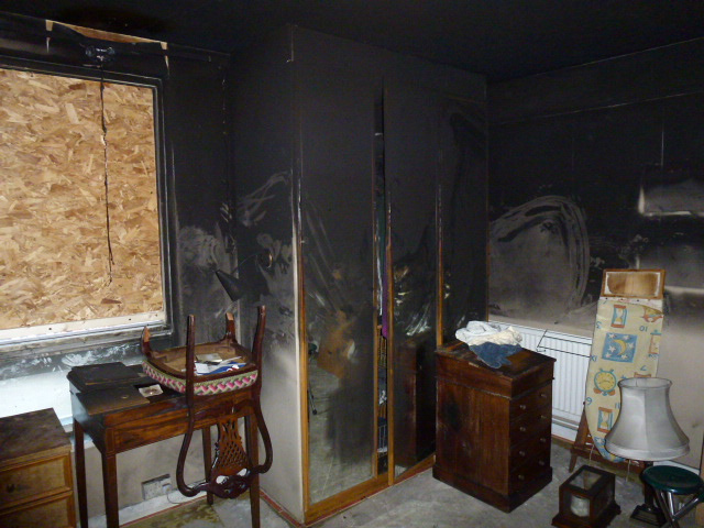 Bedroom heavily affected by fire, smoke and soot damage before restoration by Restorations UK