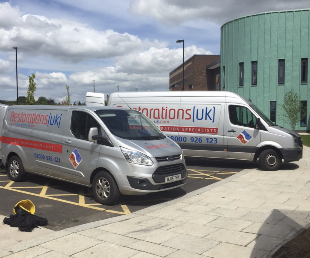 Restorations UK response vehicles attending a school water damage project
