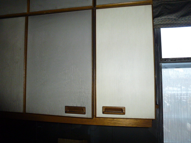 Test clean showing smoke contamination removed from kitchen cupboard doors