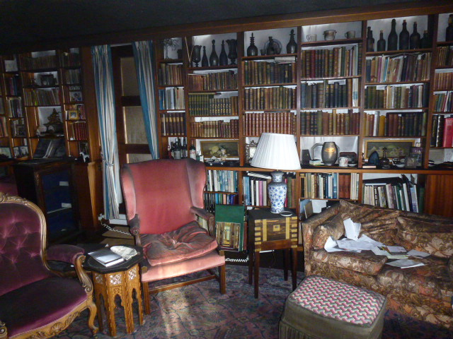 Library containing books, furniture and contents affected by fire and smoke damage